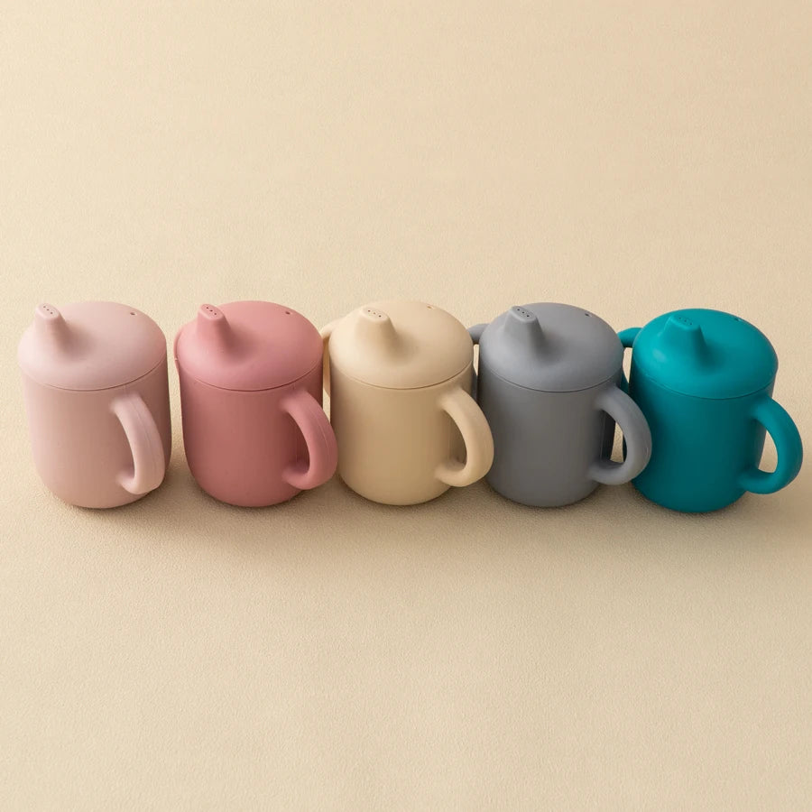 gourde bébé évolutive silicone antidérapant avec poignées et embout interchangeable